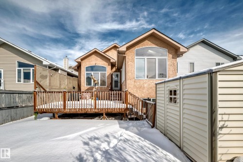 The property features a private deck with wooden railings, a shed for outdoor storage, and an exterior finished with stucco - 10631 181 Avenue, Edmonton, AB - Outdoor With Deck Patio Veranda