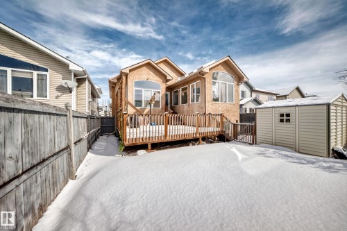 The property features a large wooden deck and a shed in the backyard - 10631 181 Avenue, Edmonton, AB - Outdoor With Deck Patio Veranda