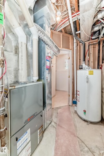 Utility area featuring a furnace and a water heater - 10631 181 Avenue, Edmonton, AB - Indoor Photo Showing Basement