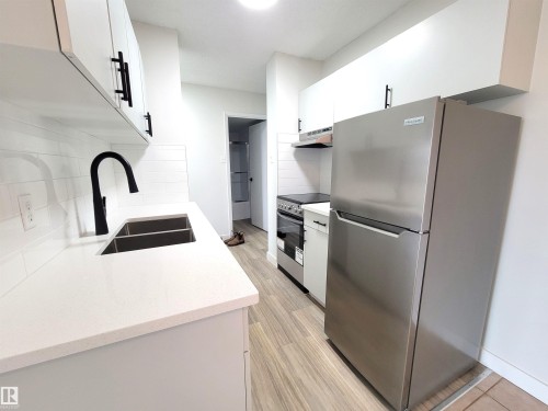 804 9028 Jasper Avenue, Edmonton, AB - Indoor Photo Showing Kitchen With Double Sink