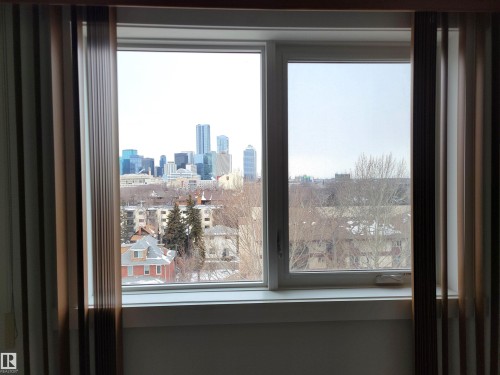 View of the City skyline from the bedroom window - 804 9028 Jasper Avenue, Edmonton, AB - Indoor Photo Showing Other Room