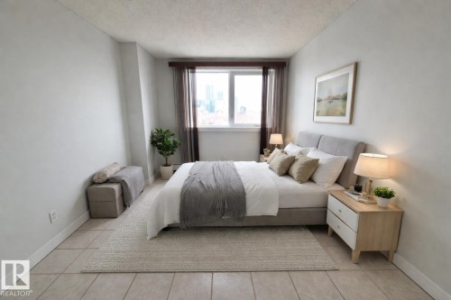 Virtually staged photo showcasing potential lay-out options for the bedroom - 804 9028 Jasper Avenue, Edmonton, AB - Indoor Photo Showing Bedroom