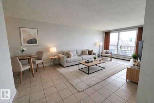 Virtually staged photo showcasing potential lay-out options for the living room - 804 9028 Jasper Avenue, Edmonton, AB - Indoor Photo Showing Living Room