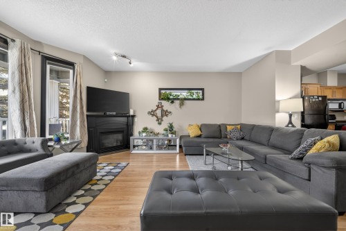 43 903 Rutherford Road, Edmonton, AB - Indoor Photo Showing Living Room With Fireplace