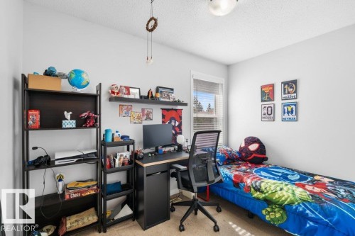 This room features light-colored walls and carpet flooring, creating a bright and neutral base - 638 Saddleback Road, Edmonton, AB - Indoor Photo Showing Bedroom