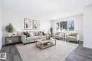 This image has been virtually staged - 129 Londonderry Square, Edmonton, AB  - Indoor Photo Showing Living Room 