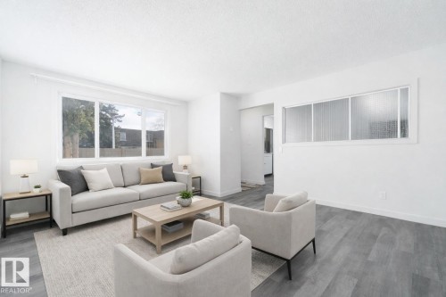 This image has been virtually staged - 129 Londonderry Square, Edmonton, AB - Indoor Photo Showing Living Room
