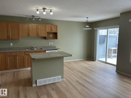 112 4350 23 Street, Edmonton, AB - Indoor Photo Showing Kitchen With Double Sink