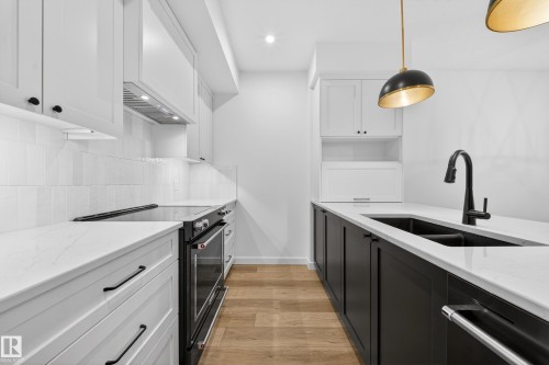 301 7459 May Common, Edmonton, AB - Indoor Photo Showing Kitchen With Double Sink With Upgraded Kitchen
