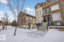 The property features a brick exterior with stone accents, offering a classic aesthetic - 2105 Casselman Link Link, Edmonton, AB  - Outdoor 