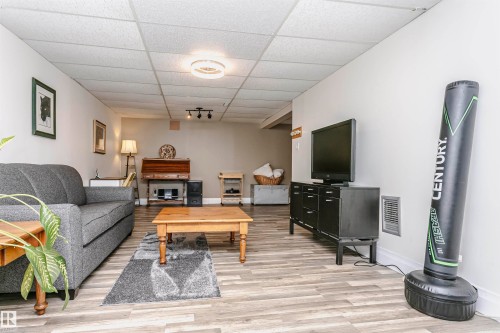 33 Sunnyside Crescent, St. Albert, AB - Indoor Photo Showing Living Room With Fireplace