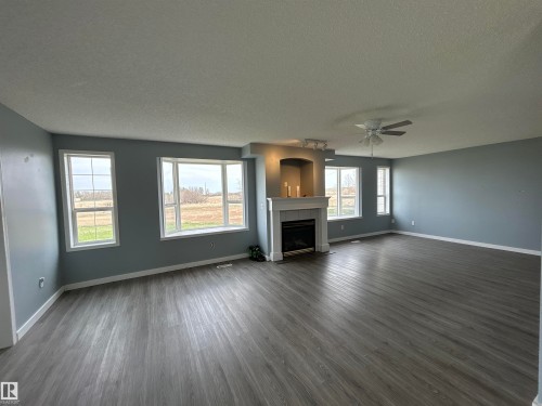 4420 50 Street, Rural Lamont County, AB - Indoor Photo Showing Living Room With Fireplace