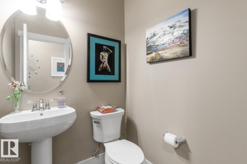Powder Room located just off the Kitchen and Living Room Space - 7432 Colonel Mewburn Road, Edmonton, AB - Indoor Photo Showing Bathroom