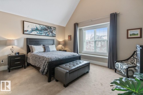 Featuring Vaulted Ceilings, Large East Facing Windows, Ensuite, and Walk In Closet - 7432 Colonel Mewburn Road, Edmonton, AB - Indoor Photo Showing Bedroom