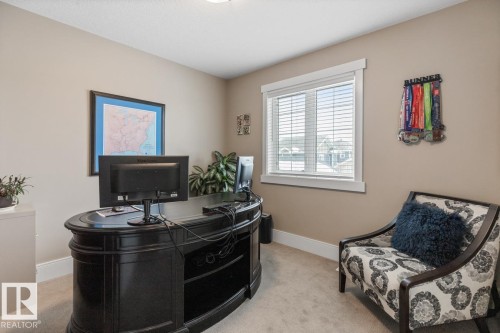 Additional Bedroom located on the Second Floor with West Facing Windows overlooking a Manicured Lawn - 7432 Colonel Mewburn Road, Edmonton, AB - Indoor Photo Showing Office