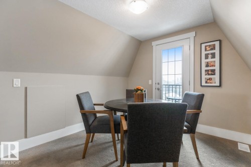 3rd Floor Bonus Room featuring East Facing Windows, a West Facing Juliet Balcony, and 4 Piece Bathroom - 7432 Colonel Mewburn Road, Edmonton, AB - Indoor Photo Showing Dining Room