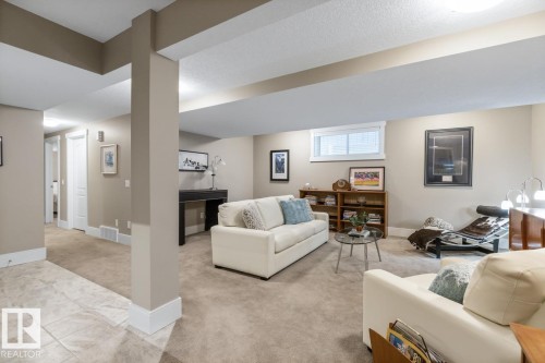 Spacious Basement Rec Room Custom Built by the Home Builder (Homes by Avi), Features a Bar Space, Full Sized Refrigerator, and Wine Room - 7432 Colonel Mewburn Road, Edmonton, AB - Indoor With Fireplace