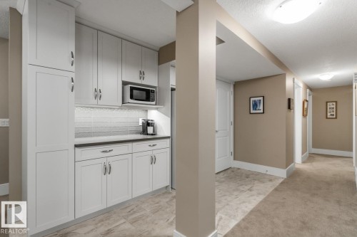 Spacious Basement Rec Room Custom Built by the Home Builder (Homes by Avi), Features a Bar Space, Full Sized Refrigerator, and Wine Room - 7432 Colonel Mewburn Road, Edmonton, AB - Indoor