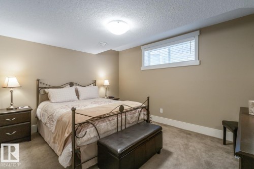 Basement Bedroom with South Facing Window - 7432 Colonel Mewburn Road, Edmonton, AB - Indoor Photo Showing Bedroom