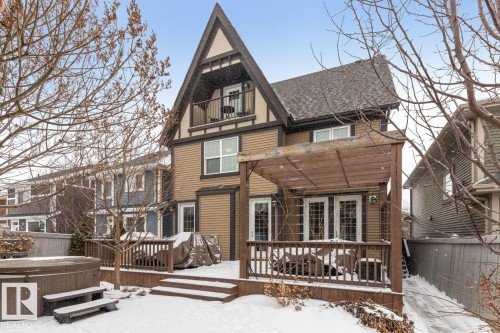 Exterior Back of House with Award Winning Low Maintenance Landscaping (Top 5 Front Yards in Bloom), Pergola, Gas BBQ Line, Outdoor Speakers and Permanent Outdoor Trimlight Lighting - 7432 Colonel Mewburn Road, Edmonton, AB - Outdoor