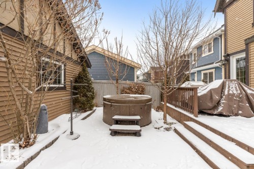 Exterior Back of House with Award Winning Low Maintenance Landscaping (Top 5 Front Yards in Bloom), Pergola, Gas BBQ Line, Outdoor Speakers and Permanent Outdoor Trimlight Lighting - 7432 Colonel Mewburn Road, Edmonton, AB - Outdoor