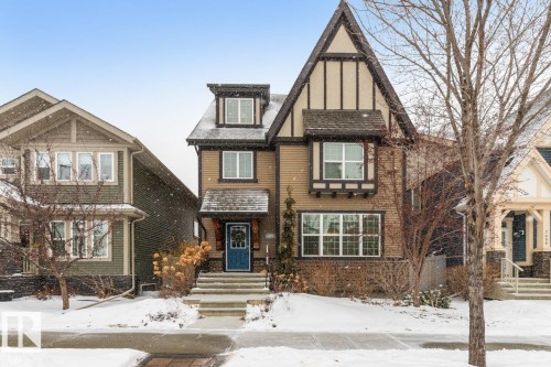 Exterior Front of House with Award Winning Low Maintenance Landscaping (Top 5 Front Yards in Bloom), Outdoor Speakers and Permanent Outdoor Trimlight Lighting - 7432 Colonel Mewburn Road, Edmonton, AB - Outdoor With Facade