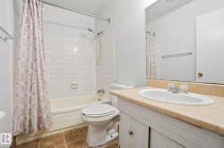Bathroom featuring shower / tub combo and vanity - 