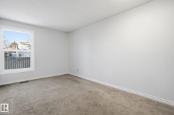 Unfurnished room with carpet and a textured ceiling - 