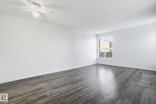 1130 Knottwood Road E, Edmonton, AB - Indoor Photo Showing Living Room With Fireplace