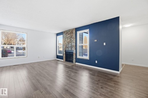 1130 Knottwood Road E, Edmonton, AB - Indoor Photo Showing Living Room With Fireplace