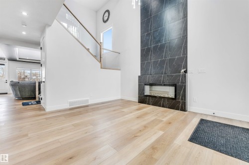 304 33 Avenue, Edmonton, AB - Indoor Photo Showing Other Room With Fireplace