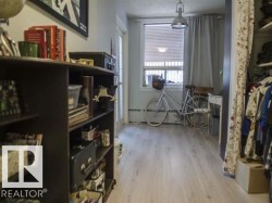 Sitting room with light wood-type flooring - 