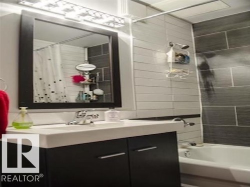 Full bathroom featuring vanity and tub / shower combination - 108 11025 Jasper Avenue, Edmonton, AB - Indoor Photo Showing Bathroom