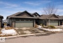 This property features an attached garage with a paved driveway - 3 8050 Orchards Green, Edmonton, AB  - Outdoor 