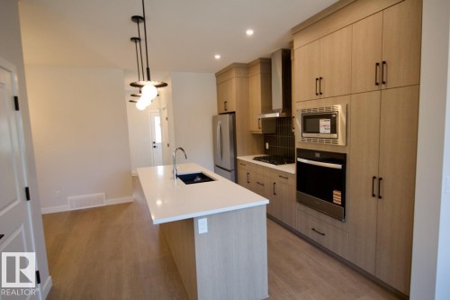 Upper 2232 Muckleplum Crescent Sw, Edmonton, AB - Indoor Photo Showing Kitchen