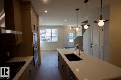Upper 2232 Muckleplum Crescent Sw, Edmonton, AB - Indoor Photo Showing Kitchen With Double Sink With Upgraded Kitchen