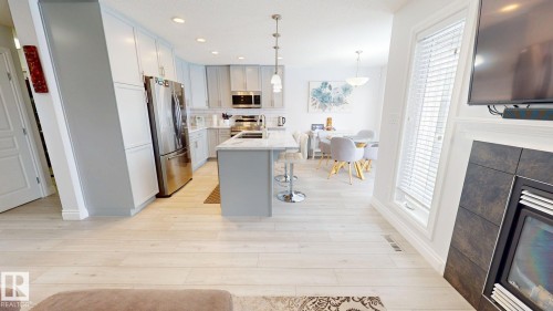 2057 69A Street, Edmonton, AB - Indoor Photo Showing Kitchen With Fireplace With Upgraded Kitchen