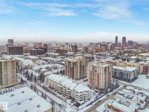 Aerial view facing southwest, showcasing the urban landscape with various residential buildings and the city skyline - 515 10311 111 Street, Edmonton, AB - Outdoor With View