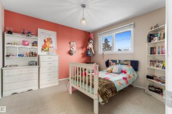 Bedroom with light carpet and a textured ceiling - 