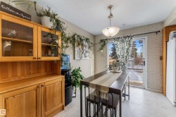 Dining area with brick wall and a textured ceiling - 