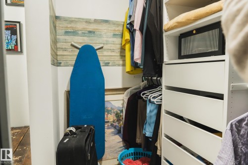 This property features a custom closet organization system with white drawers and shelving, providing ample storage space - 303 10432 76 Avenue, Edmonton, AB - Indoor Photo Showing Other Room