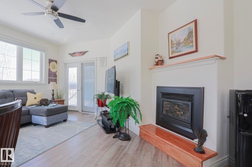 8 Main Street, Entwistle, AB - Indoor Photo Showing Living Room With Fireplace