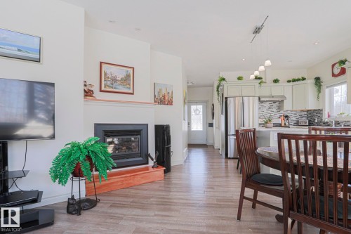8 Main Street, Entwistle, AB - Indoor Photo Showing Dining Room With Fireplace