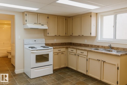 10831 80 Avenue, Edmonton, AB - Indoor Photo Showing Kitchen With Double Sink