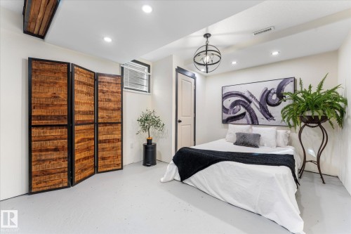 Living area featuring recessed lighting, a ceiling-mounted light fixture, and light-colored flooring - 11124 110A Avenue, Edmonton, AB - Indoor Photo Showing Bedroom