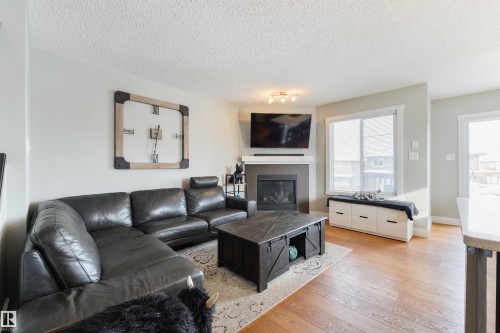 60 Vanderbilt Common, Spruce Grove, AB - Indoor Photo Showing Living Room With Fireplace