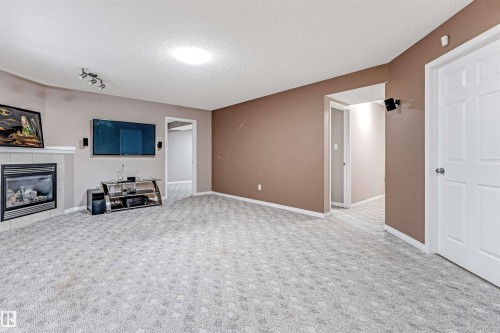 3331 26 Street, Edmonton, AB - Indoor Photo Showing Other Room With Fireplace