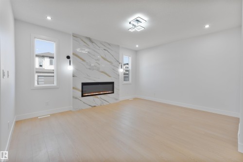 215 Falcon Crescent, Leduc, AB - Indoor With Fireplace