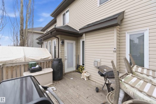The property features a private wooden deck, offering an outdoor living space - 2037 69A Street, Edmonton, AB - Outdoor With Exterior