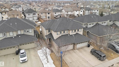 Aerial view showcasing the property's dark shingle roof and light-colored exterior, along with a two-car garage - 2037 69A Street, Edmonton, AB - Outdoor